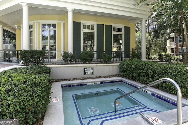 view of pool featuring a community hot tub