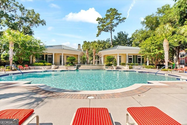 community pool with a patio