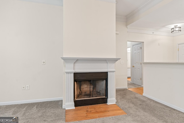 room details with carpet flooring, a fireplace, baseboards, and ornamental molding