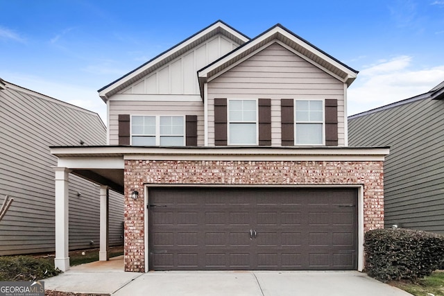 view of front of house with brick siding, board and batten siding, concrete driveway, and an attached garage