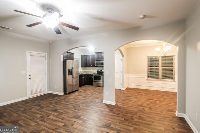 kitchen featuring visible vents, arched walkways, appliances with stainless steel finishes, and dark wood-style floors