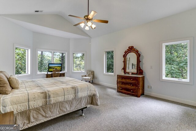 carpeted bedroom featuring visible vents, baseboards, a ceiling fan, and vaulted ceiling