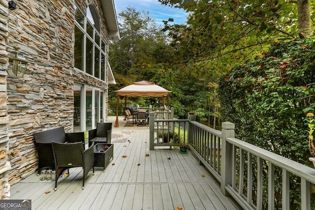 deck with outdoor dining area