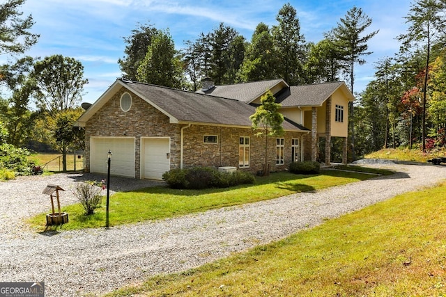 view of front of property with a front yard, driveway, an attached garage, a chimney, and stone siding