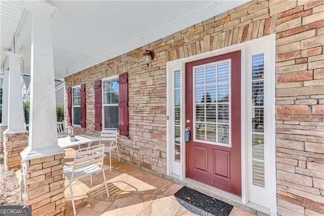 property entrance with covered porch