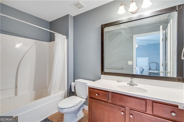 full bath featuring vanity, visible vents, shower / bath combo with shower curtain, toilet, and connected bathroom