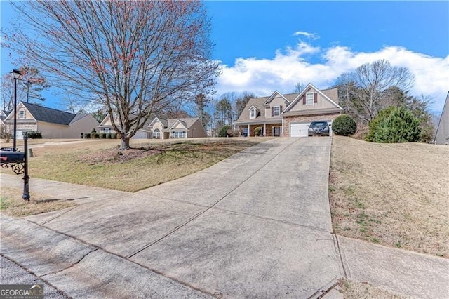 view of front of house featuring driveway and a garage