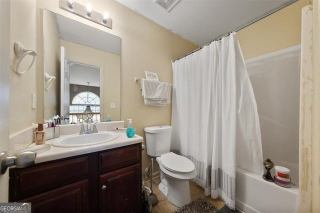 full bath with vanity, visible vents, tile patterned flooring, shower / bath combo with shower curtain, and toilet