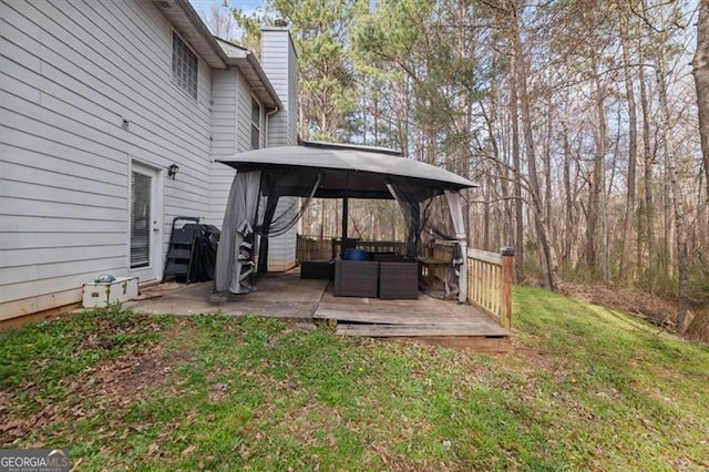 view of yard with a deck and a gazebo