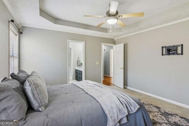 4125 Gables Pl, Buford, GA 30519 - bedroom with a raised ceiling, carpet floors, a ceiling fan, ensuite bathroom, and ornamental molding