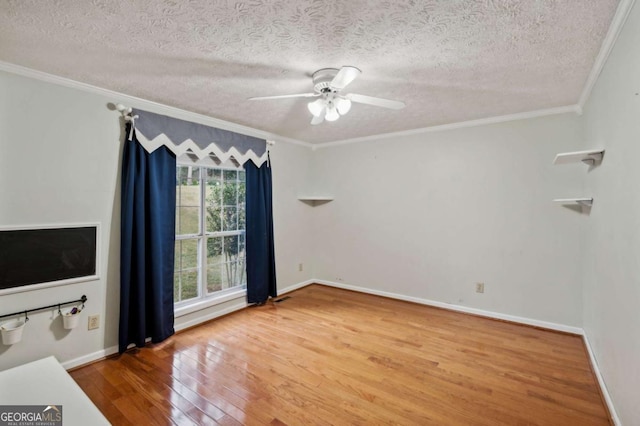 4125 Gables Pl, Buford, GA 30519 - unfurnished room with wood finished floors, ornamental molding, a textured ceiling, and ceiling fan