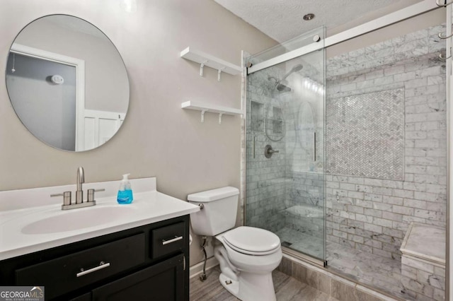 4125 Gables Pl, Buford, GA 30519 - full bathroom featuring vanity, a stall shower, and wood finished floors
