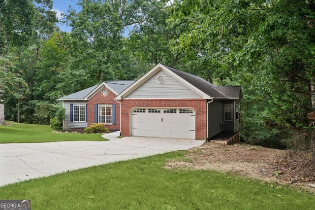 4125 Gables Pl, Buford, GA 30519 - view of front of house with a garage, brick siding, driveway, and a front yard