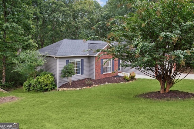 4125 Gables Pl, Buford, GA 30519 - view of side of property featuring a lawn and a shingled roof