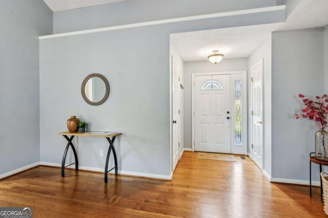 4125 Gables Pl, Buford, GA 30519 - foyer entrance with wood finished floors and baseboards