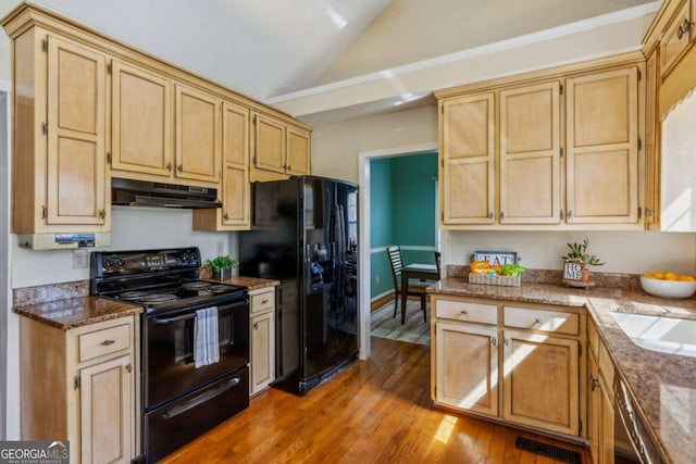4125 Gables Pl, Buford, GA 30519 - kitchen featuring black appliances, under cabinet range hood, lofted ceiling, wood finished floors, and light brown cabinets