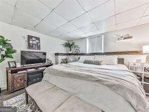 bedroom featuring a drop ceiling