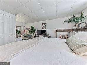 bedroom featuring a paneled ceiling