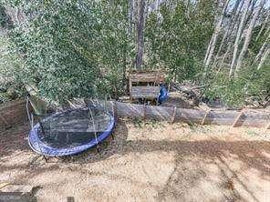 view of yard with a trampoline