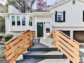 entrance to property featuring a garage and driveway