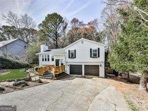 view of front of property featuring driveway and an attached garage