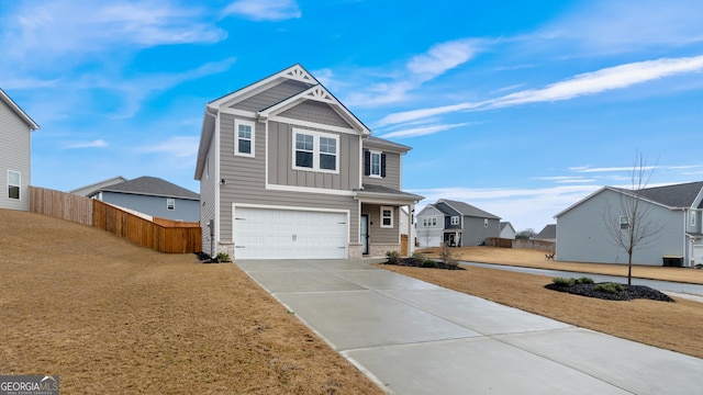 view of front of home with fence, a residential view, board and batten siding, concrete driveway, and an attached garage