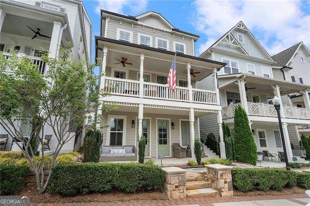 view of front of home with a balcony, covered porch, and a ceiling fan