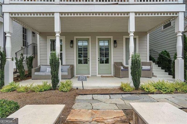 view of exterior entry featuring a porch