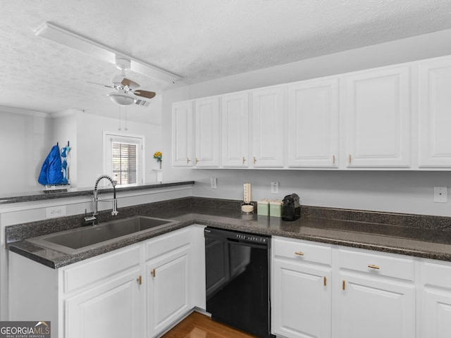 kitchen with dishwasher, white cabinets, a textured ceiling, a ceiling fan, and a sink