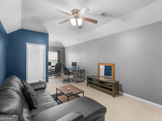 living area featuring a ceiling fan, carpet, visible vents, baseboards, and lofted ceiling