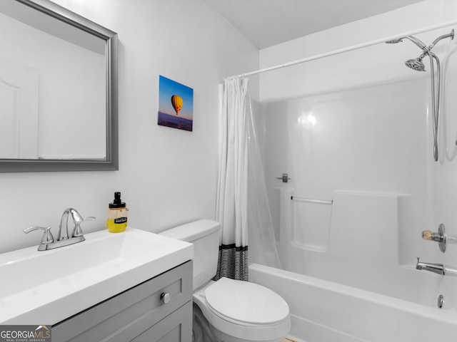 bathroom with vanity, toilet, and shower / bath combo