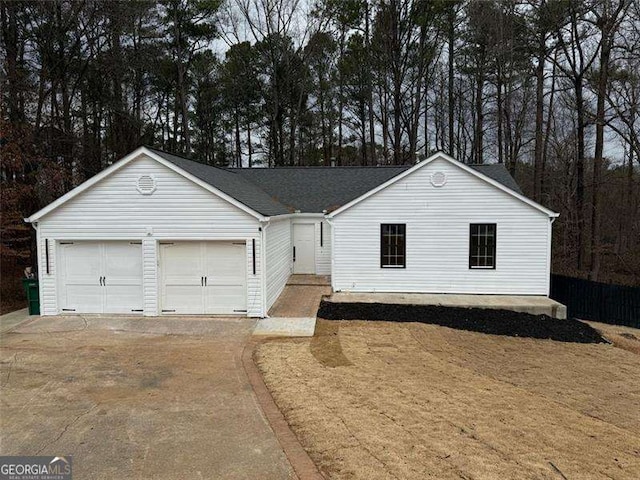 ranch-style home featuring an attached garage