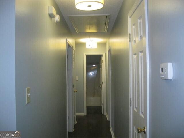 103 Twilight Ct, Jackson, GA 30233 - hallway with attic access and baseboards