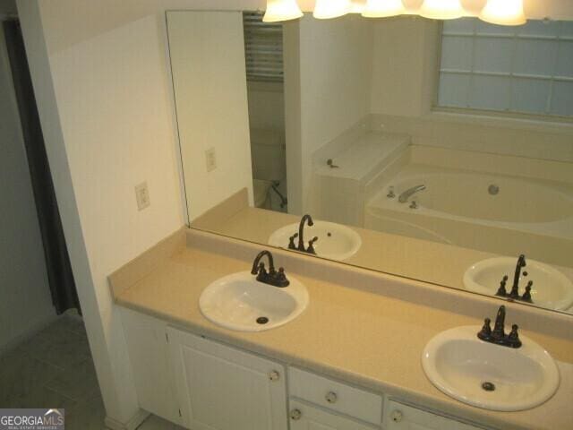 103 Twilight Ct, Jackson, GA 30233 - full bath featuring a sink, a bath, and double vanity