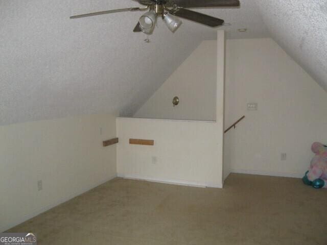 103 Twilight Ct, Jackson, GA 30233 - bonus room with a textured ceiling, lofted ceiling, carpet flooring, and ceiling fan