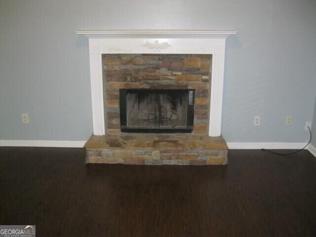 103 Twilight Ct, Jackson, GA 30233 - interior details featuring baseboards, a stone fireplace, and wood finished floors
