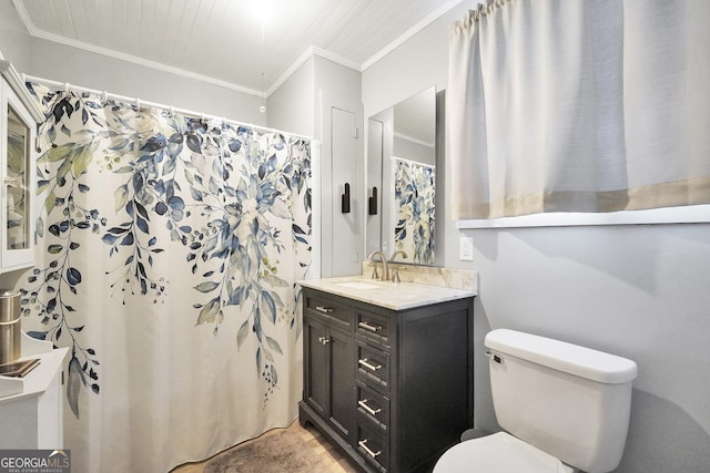 bathroom with toilet, ornamental molding, and vanity