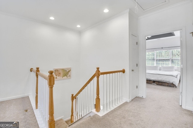 hall with recessed lighting, an upstairs landing, ornamental molding, and carpet flooring