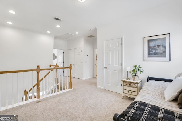 interior space with visible vents, baseboards, recessed lighting, carpet flooring, and an upstairs landing