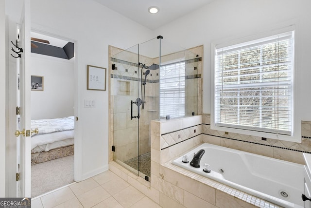 ensuite bathroom featuring tile patterned flooring, ensuite bath, a jetted tub, and a stall shower