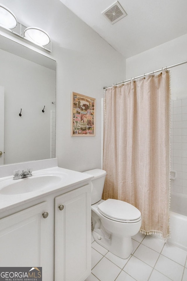 bathroom with tile patterned floors, visible vents, toilet, shower / bath combo, and vanity