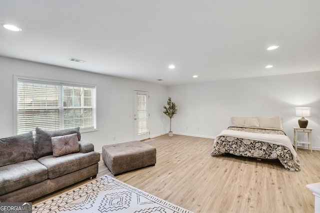 bedroom featuring recessed lighting, visible vents, and light wood finished floors