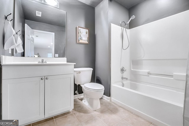 full bath with vanity, baseboards, bathing tub / shower combination, tile patterned floors, and toilet