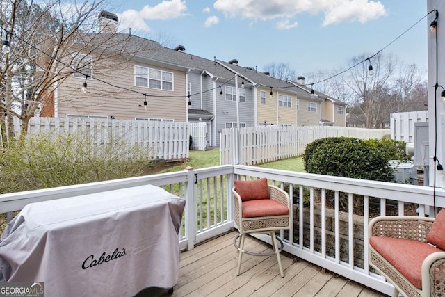 wooden deck featuring fence and a residential view