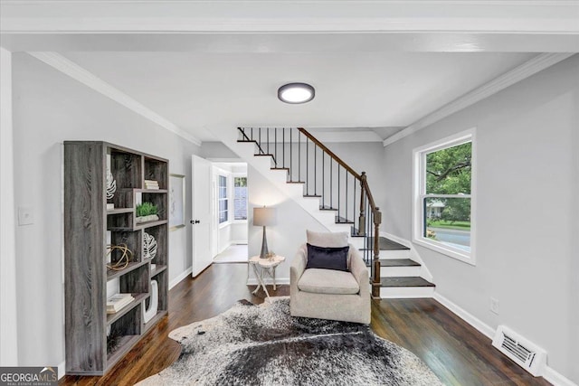 sitting room featuring visible vents, crown molding, baseboards, stairs, and wood finished floors