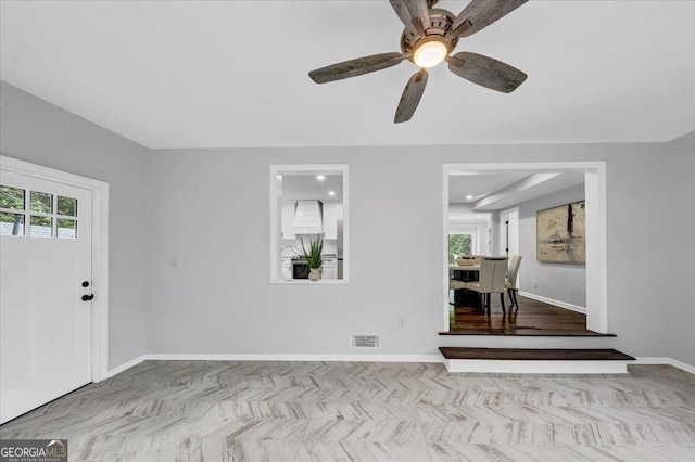 foyer with visible vents and baseboards