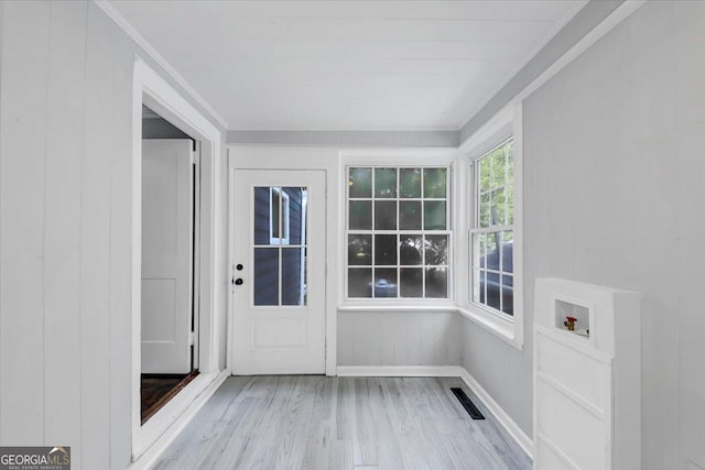 unfurnished sunroom with visible vents