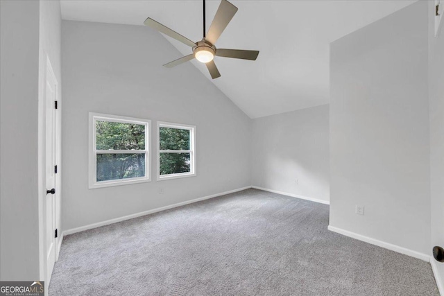 unfurnished room featuring high vaulted ceiling, baseboards, carpet floors, and ceiling fan