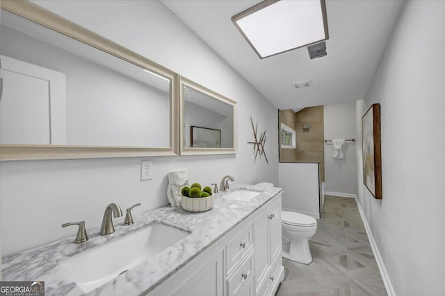 bathroom featuring walk in shower, toilet, visible vents, and a sink