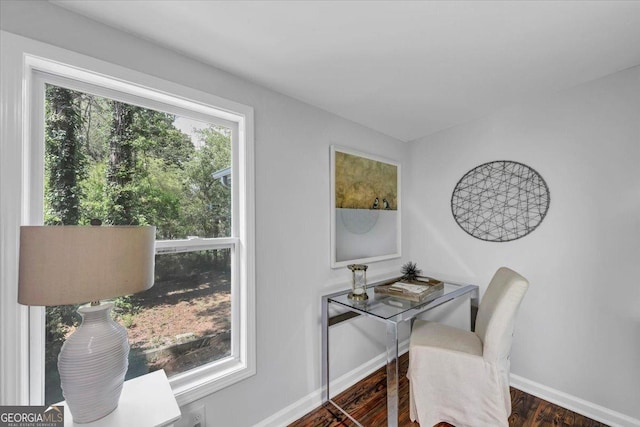 home office featuring baseboards and wood finished floors